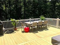 <b>Pressure Treated Wood Deck with Breaker Board and White Washington Vinyl Railing</b>